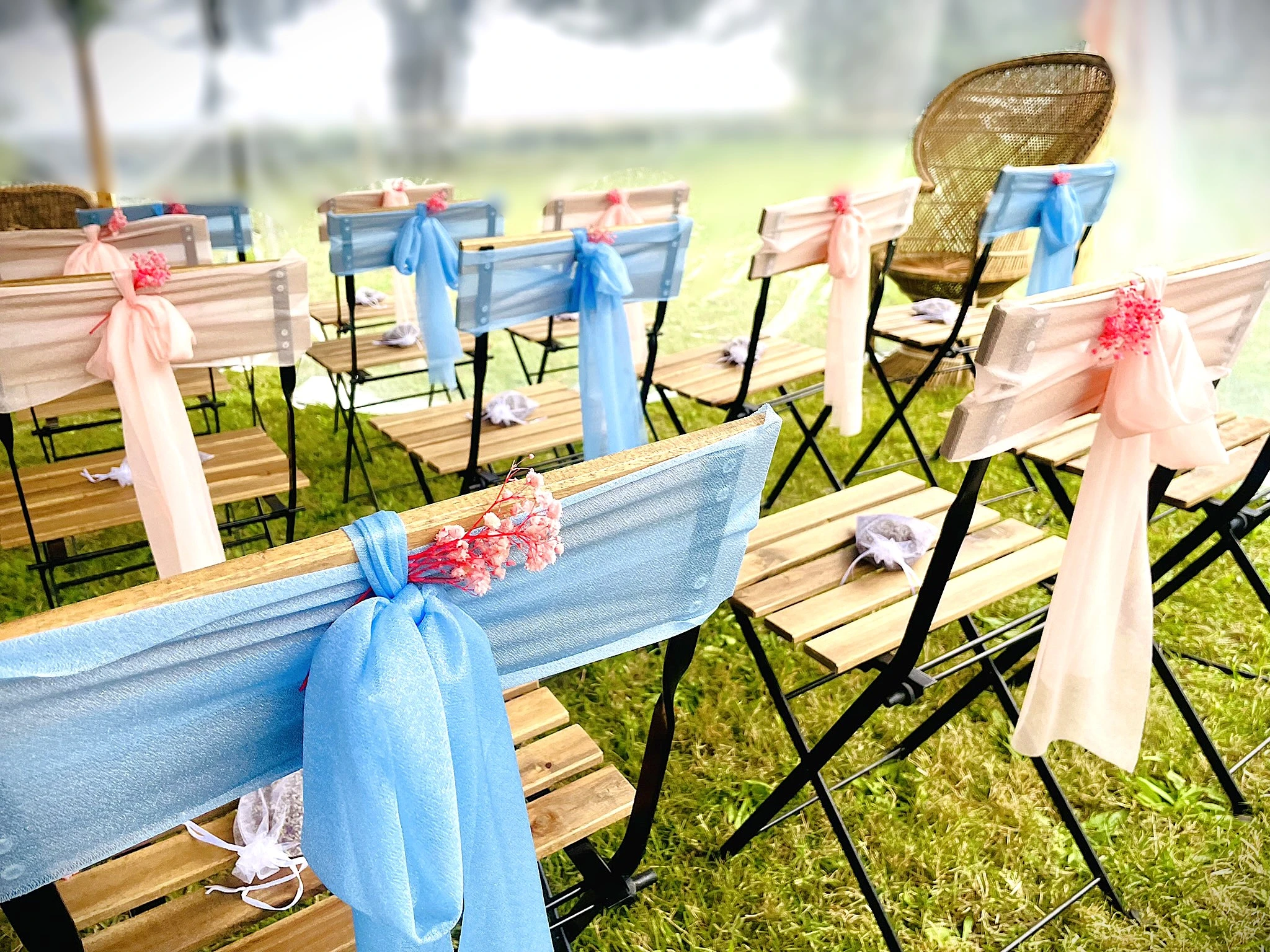 A couple smiling and cutting a wedding cake together.