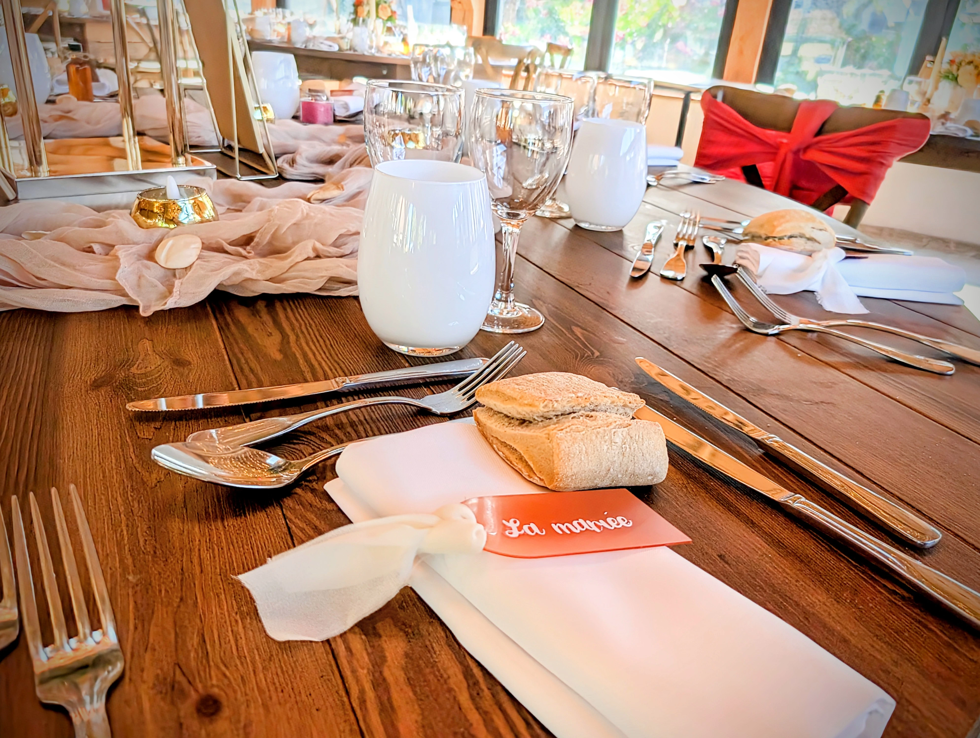 A young woman holding a slice of chocolate cake, surrounded by confetti.